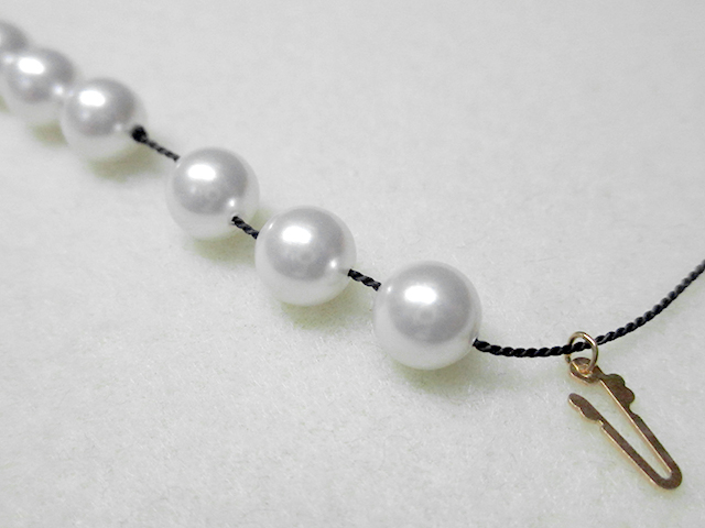 Knotting Pearls with a Clasp Step 11