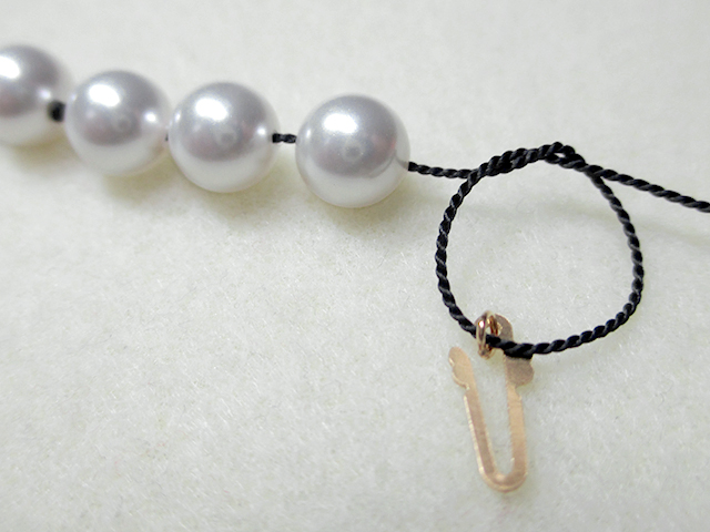 Knotting Pearls with a Clasp Step 12