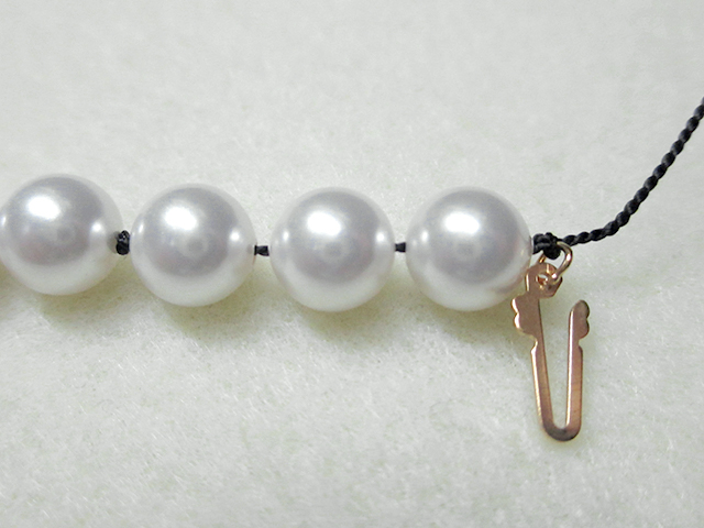 Knotting Pearls with a Clasp Step 14