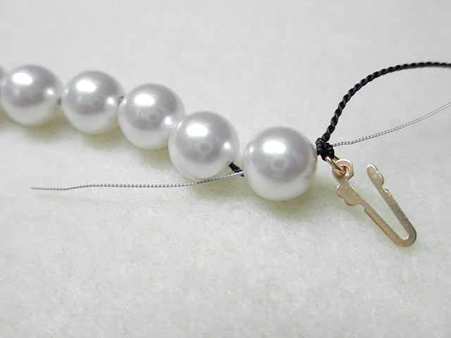 Knotting Pearls with a Clasp Step 15