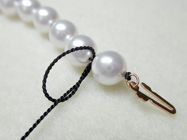 Knotting Pearls with a Clasp Step 16