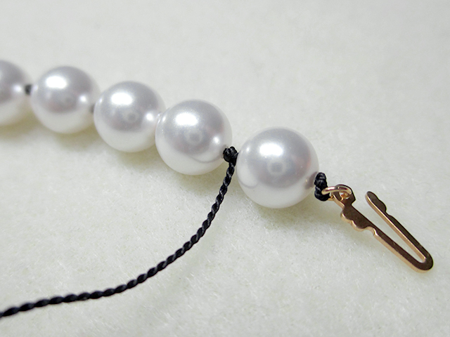 Knotting Pearls with a Clasp Step 17